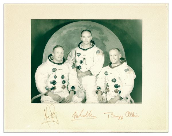 Signatures of Neil Armstrong, Michael Collins and Buzz Aldrin -- Surrounding a Portrait of the Apollo 11 Crew