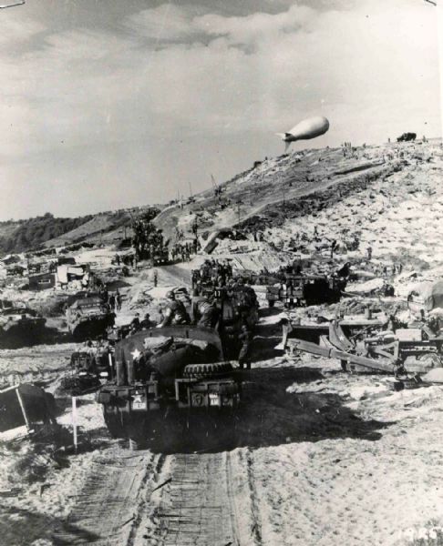 Original World War II 8'' x 10'' Black and White Glossy Press Photo of Omaha Beach, France -- Three Days after D-Day Invasion -- Near Fine