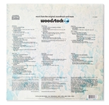 Woodstock Album Signed by Photographer Burk Uzzle & the Iconic Couple -- ''...Someone with a guitar here, someone making love there, someone smoking a joint...a bombardment of the senses...''