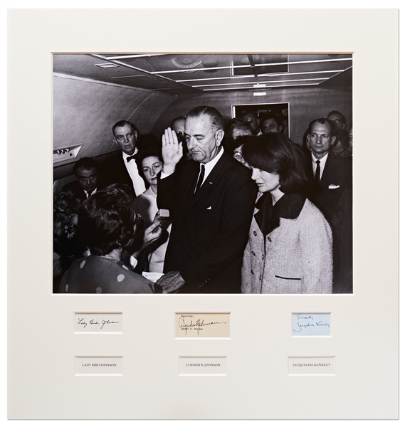 Signed 25.25 x 27 Photo Display of Lyndon B. Johnson Taking the Oath of Office Aboard AF1, Next to a Grieving Jackie Kennedy -- Signed by Jackie and Lyndon & Lady Bird Johnson, With PSA/DNA COAs