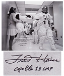 Fred Haise Signed 20 x 16 Photo of Apollo 10 Commander Tom Stafford Tapping Snoopys Nose Before the Mission -- Haise Writes: NASA adopted Charles Schulzs Snoopy as the official...mascot