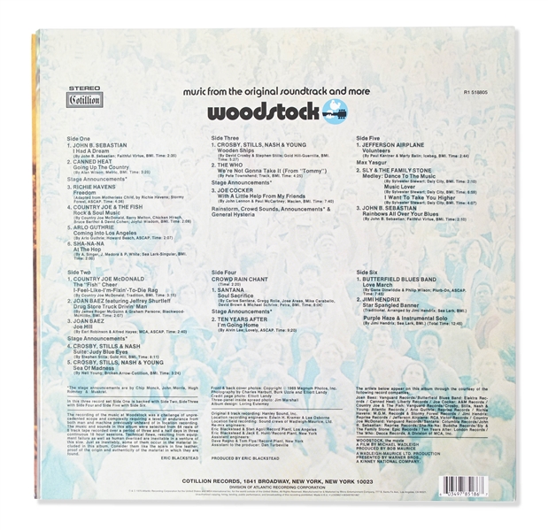 Woodstock Album Signed by Photographer Burk Uzzle & the Iconic Couple -- ''...Someone with a guitar here, someone making love there, someone smoking a joint...a bombardment of the senses...''