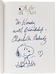 Charles Schulz Signed Snoopy Sketch, Drawn Within a First Edition of the Large Coffee Table Book ''40 Years Life and Art''