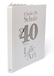 Charles Schulz Signed Snoopy Sketch, Drawn Within a First Edition of the Large Coffee Table Book ''40 Years Life and Art''