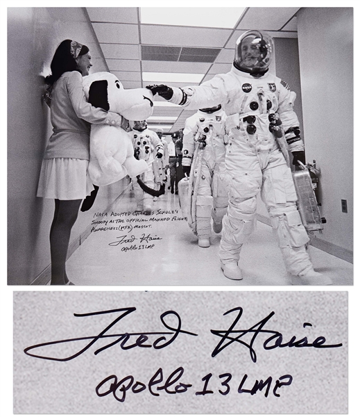 Fred Haise Signed 20'' x 16'' Photo of Apollo 10 Commander Tom Stafford Tapping Snoopy's Nose Before the Mission -- Haise Writes: ''NASA adopted Charles Schulz's Snoopy as the official...mascot''