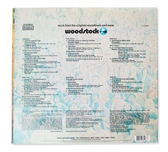 Woodstock Album Signed by Photographer Burk Uzzle & the Iconic Couple -- ''...Someone with a guitar here, someone making love there, someone smoking a joint...a bombardment of the senses...''