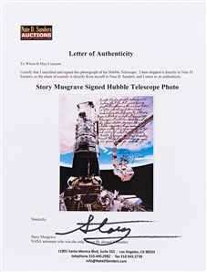 Astronaut Story Musgrave Signed 20'' x 16'' Photo of Musgrave Fixing the Hubble Space Telescope -- ''...Science is often visual, so it doesn't need translation...''